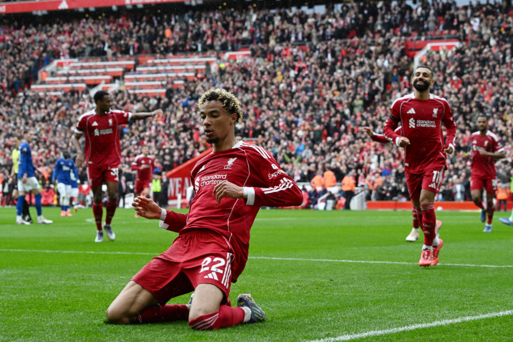 Hugo Ekitike celebrates with a knee slide after scoring for Liverpool against Everton in the Premier League at Anfield
