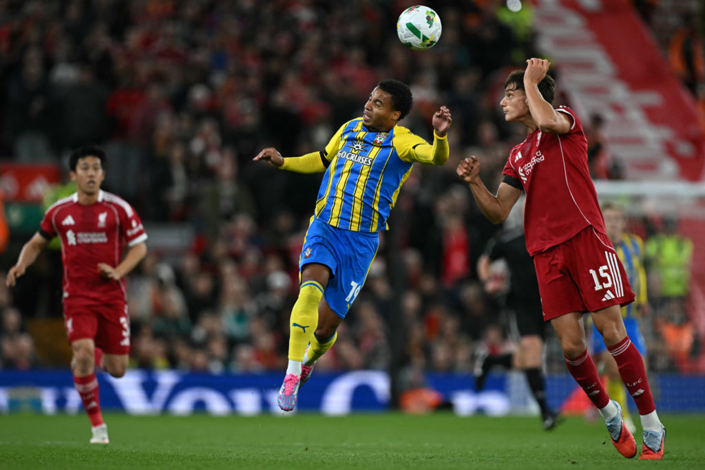 Southampton's English striker #19 Cameron Archer (C) vies with Liverpool's Italian defender #15 Giovanni Leoni (R) during the English League Cup third round football match between Liverpool and Southampton at Anfield