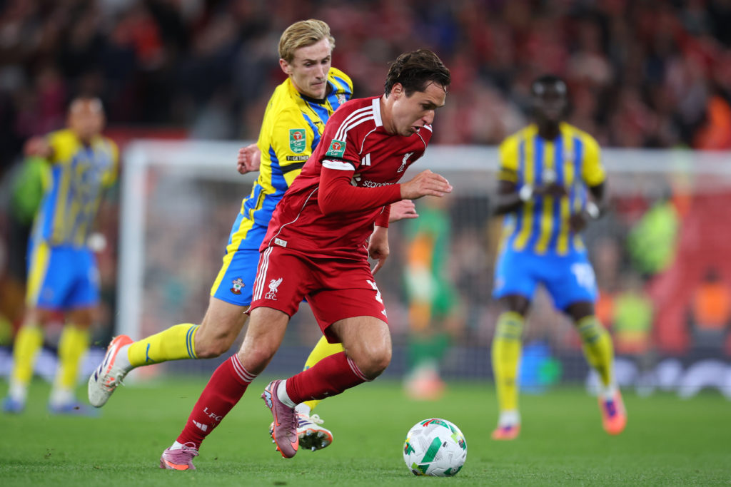 Flynn Downes of Southampton and Federico Chiesa of Liverpool challenge during the Carabao Cup Third Round match between Liverpool and Southampton at Anfield