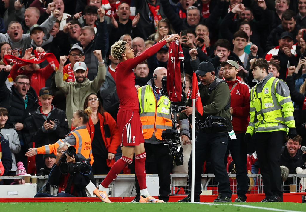 Hugo Ekitike celebrates by showing his shirt to the Anfield crowd after scoring in the EFL Cup against Southampton