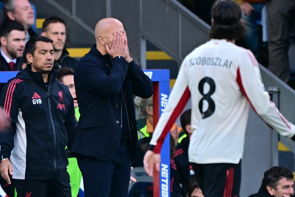 Arne Slot puts his head in his hands during Crystal Palace game