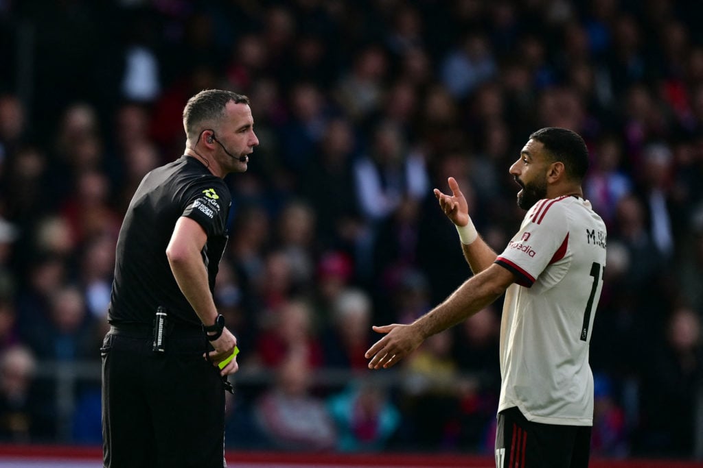 Mohamed Salah speaks to referee Chris Kavanagh during Liverpool's Premier League match against Crystal Palace at Selhurst Park