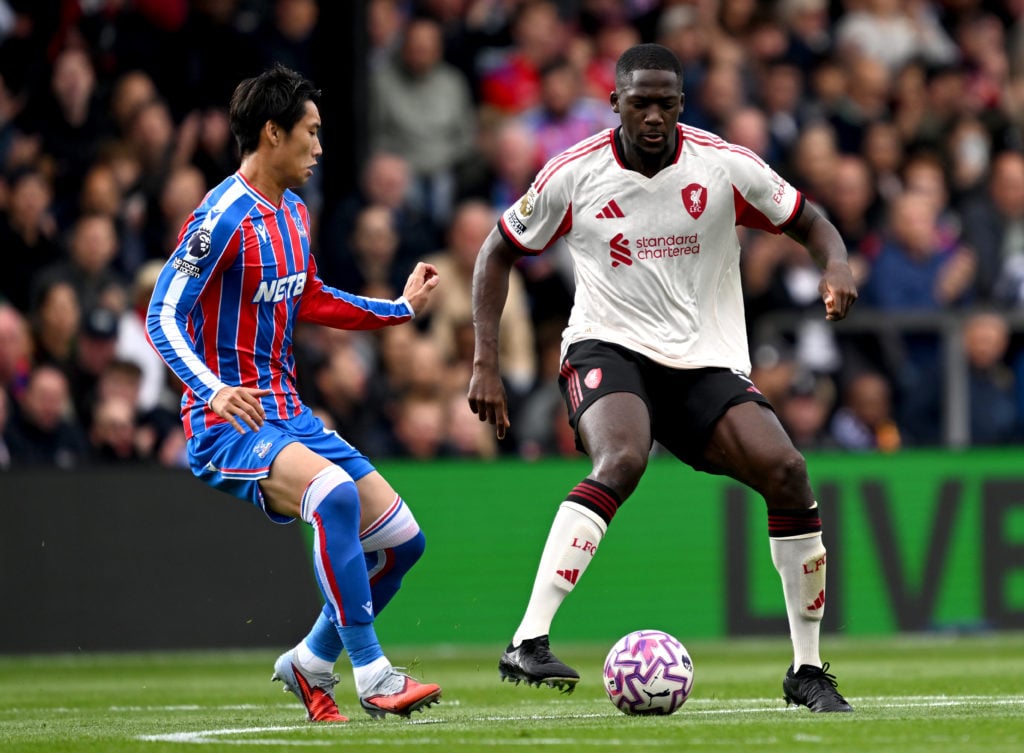 Ibrahima Konate of Liverpool is challenged by Daichi Kamada of Crystal Palace during the Premier League match between Crystal Palace and Liverpool at Selhurst Park on September 27.
