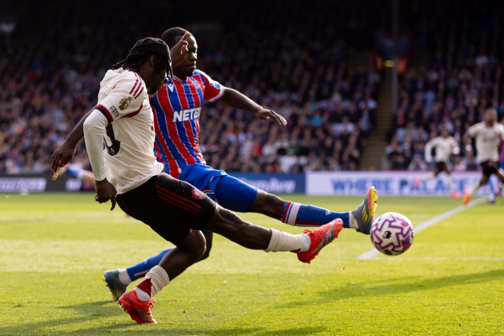 Jeremie Frimpong battles with a Crystal Palace player to deliver a ball