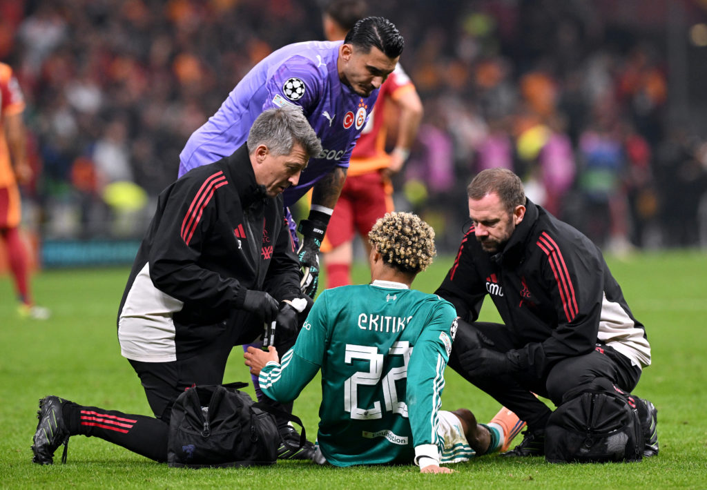 Hugo Ekitike receives treatment during Liverpool's UEFA Champions League match against Galatasaray at Rams Park.