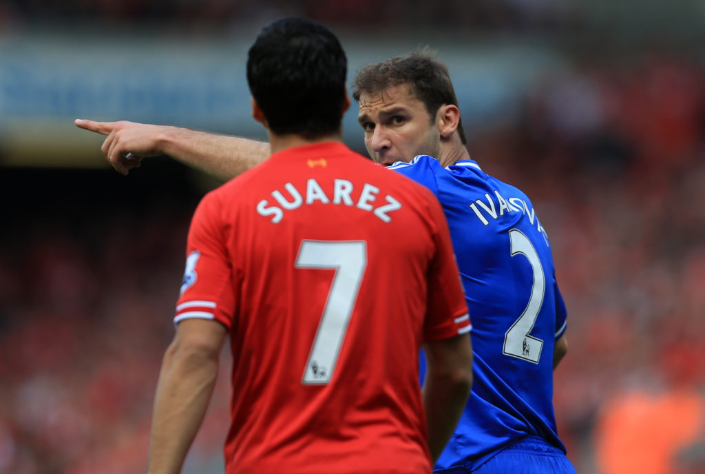 Branislav Ivanovic of Chelsea points something out to Luis Suarez of Liverpool during the Barclays Premier League match between Liverpool and Chelsea at Anfield