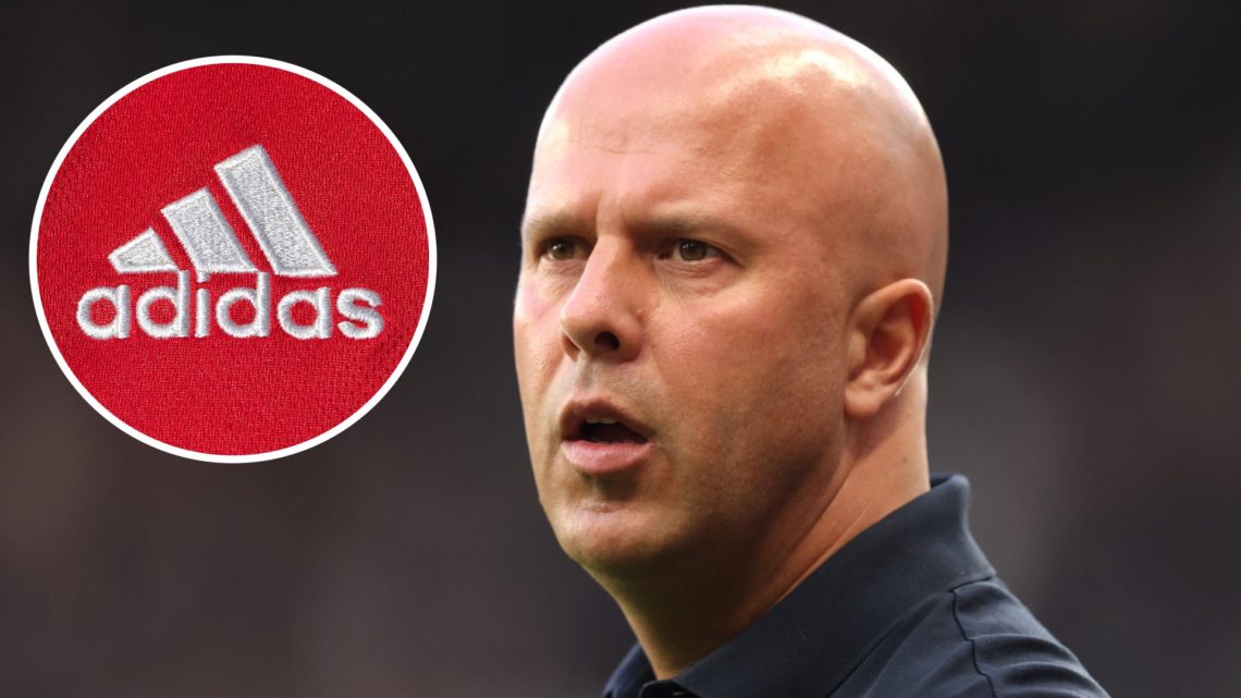 A detailed view of an Adidas logo. Arne Slot, Manager of Liverpool, looks on prior to the Premier League match between Newcastle United and Liverpo...