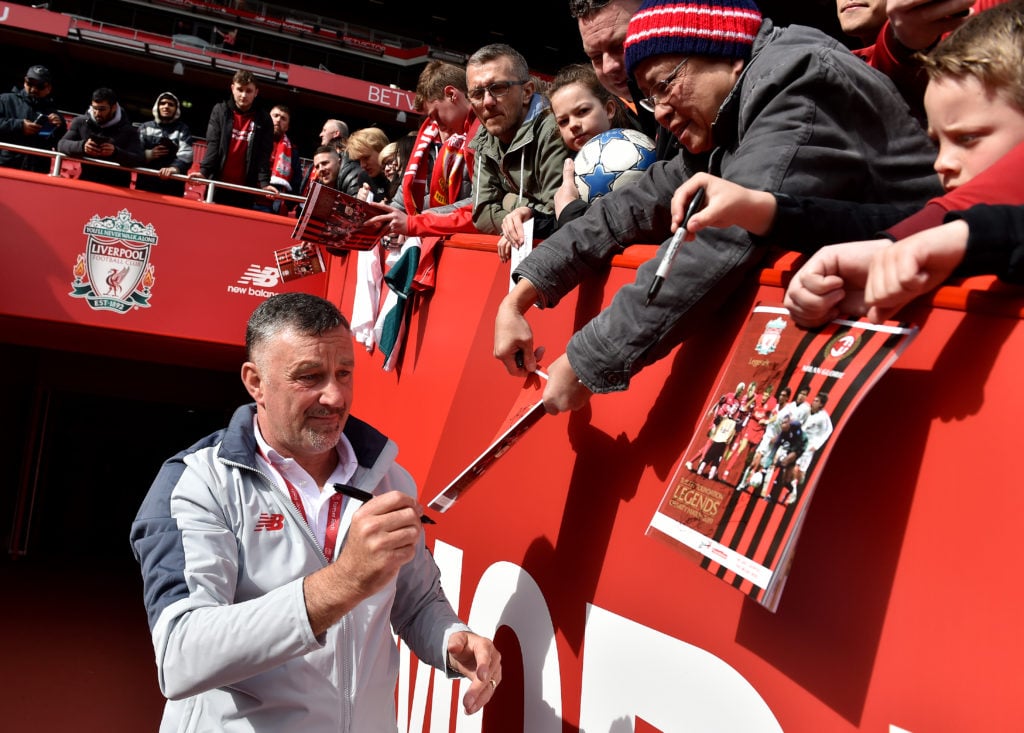 John Aldridge signs fans memorabilia at charity match