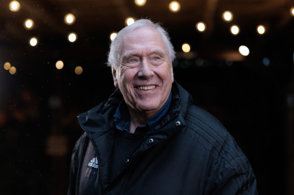 Martin Tyler smiles during photo portrait