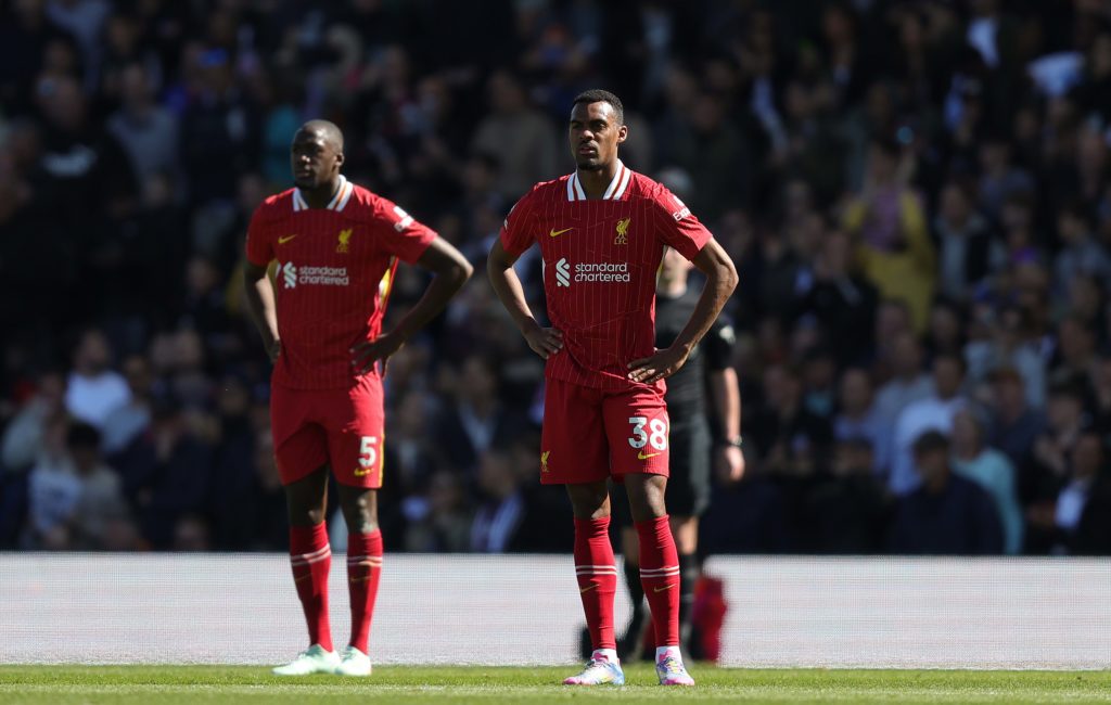 Ibrahima Konate and Ryan Gravenberch stand with hands on hips after Fulham's goal against Liverpool during the Premier League match at Craven Cottage.