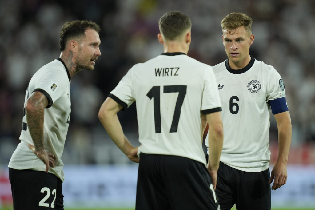 Joshua Kimmich of Germany speaks to Florian Wirtz and David Raum during the FIFA World Cup 2026 qualifier match between Germany and Northern Ireland at RheinEnergieStadion