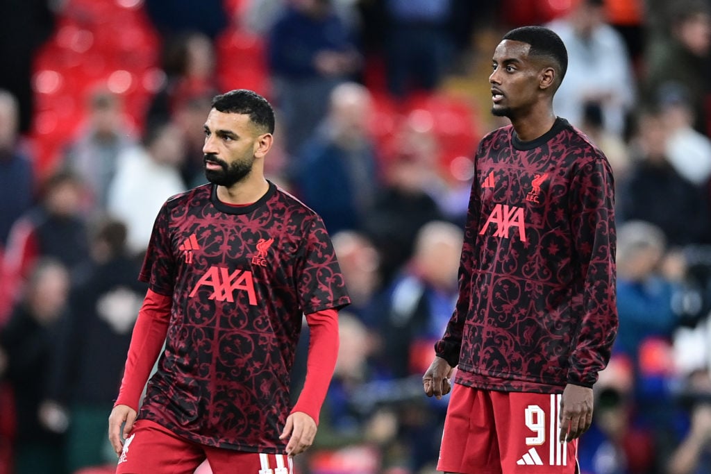 Liverpool's Mohamed Salah warms up with Alexander Isak during the UEFA Champions League 2025/26 League Phase MD1 match between Liverpool FC and Atletico de Madrid at Anfield.