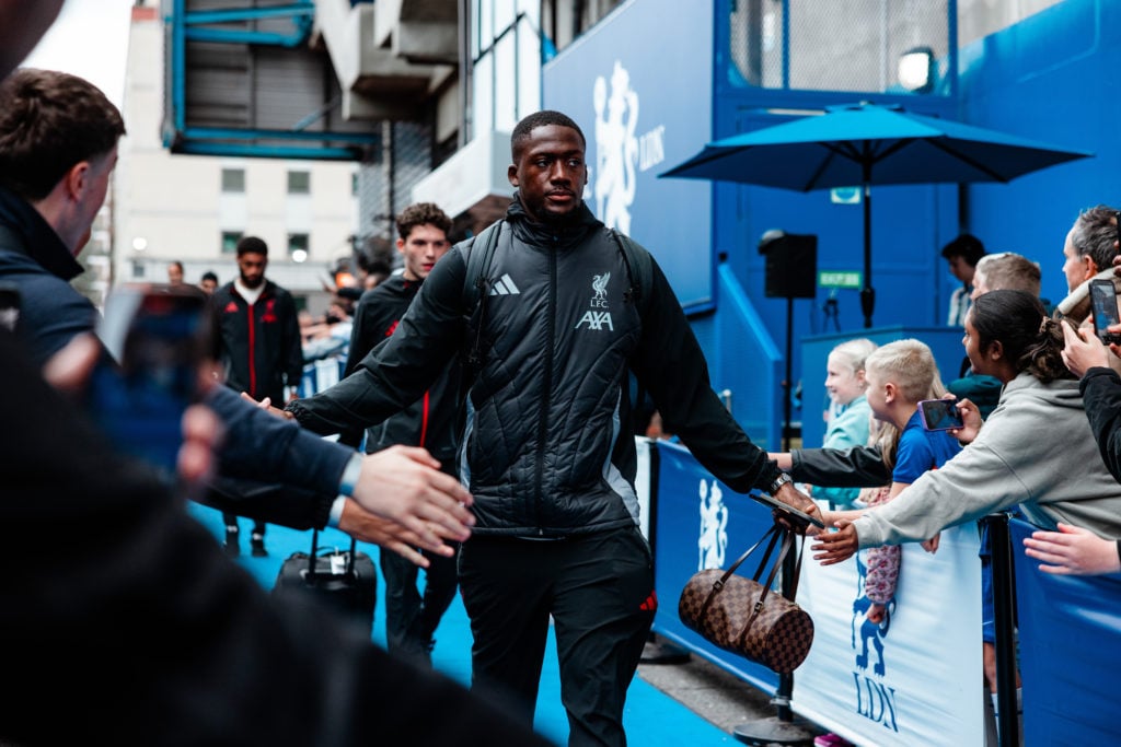 Ibrahima Konate greets fans as he arrives at Stamford Bridge ahead of Liverpool's Premier League match against Chelsea.