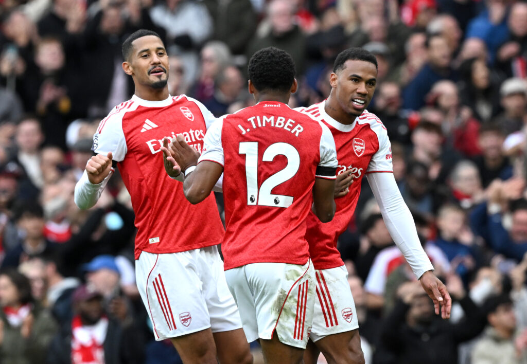 William Saliba, Gabriel and Jurrien Timber of Arsenal celebrate their team's second goal scored by Bukayo Saka of Arsenal (not pictured) from the penalty spot during the Premier League match between Arsenal and West Ham United at Emirates Stadium