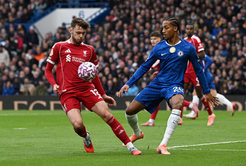 Conor Bradley battles for the ball with Joao Pedro during the Premier League match between Chelsea and Liverpool at Stamford Bridge.