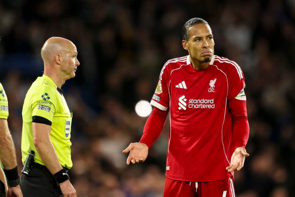 Virgil van Dijk shrugs his shoulders at the referee during Chelsea game