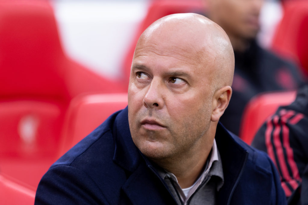 Arne Slot looks on from the bench during Liverpool vs Man Utd