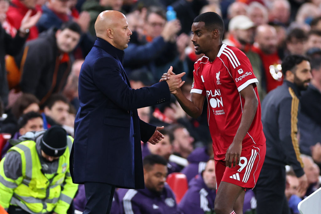 Arne Slot manager / head coach of Liverpool and Alexander Isak of Liverpool during the Premier League match between Liverpool and Manchester United at Anfield