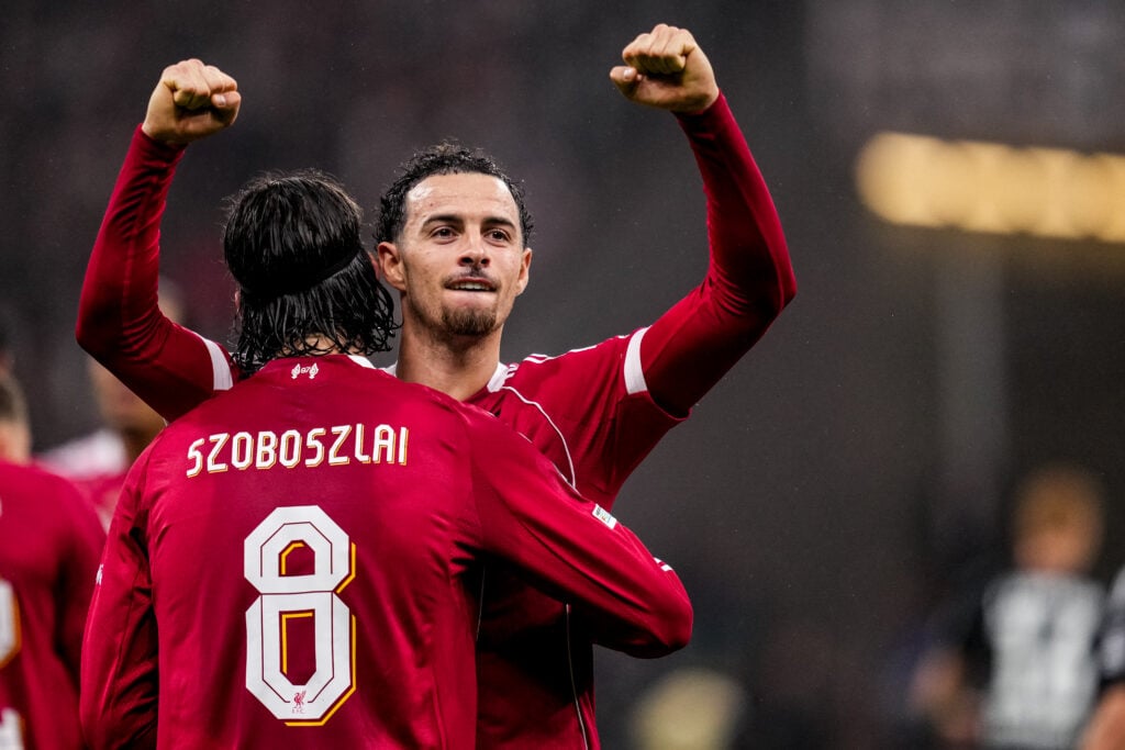 Dominik Szoboszlai of Liverpool celebrates with Curtis Jones of Liverpool after scoring his team's first goal during the UEFA Champions League 2025/26 League Phase MD3 match between Eintracht Frankfurt and Liverpool FC at Frankfurt Stadion
