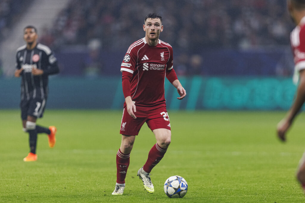 Andy Robertson on the ball during Liverpool's UEFA Champions League match against Eintracht Frankfurt at Deutsche Bank Park.