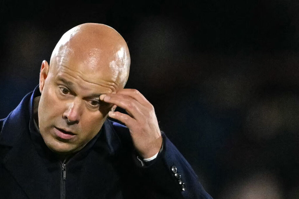 Arne Slot scratches his eye after Brentford loss