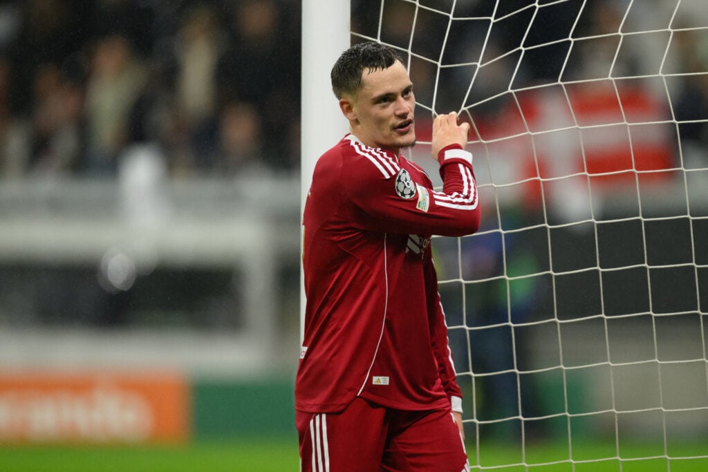 Florian Wirtz grabbing the net during Liverpool's Champions League game v Eintracht Frankfurt.