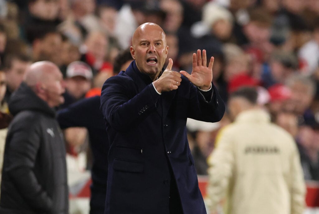 Arne Slot motions to his players during Liverpool's Premier League match against Brentford at the Gtech Community Stadium.