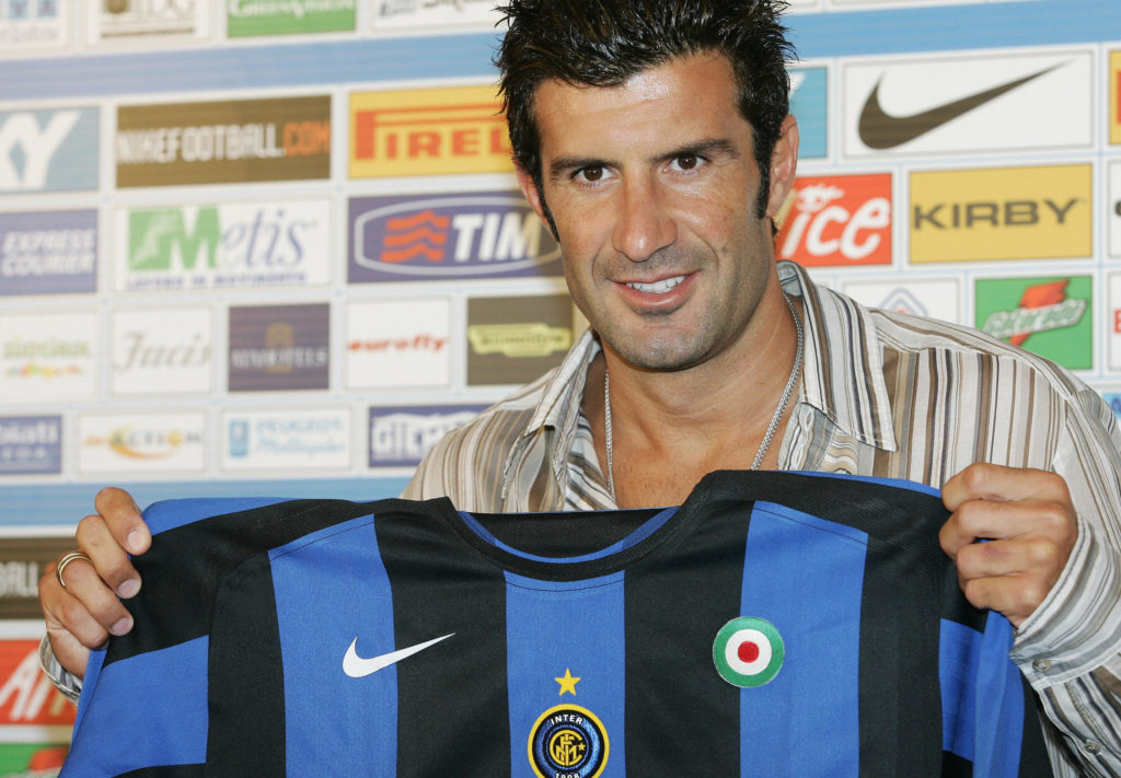 Portuguese football star Luis Figo poses