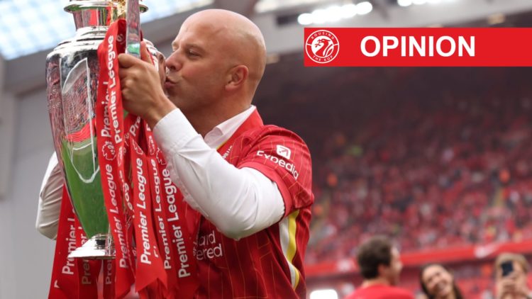 Liverpool head coach Arne Slot kisses the Premier League trophy in front of the Kop on the final day of the 2024/25 season at Anfield.