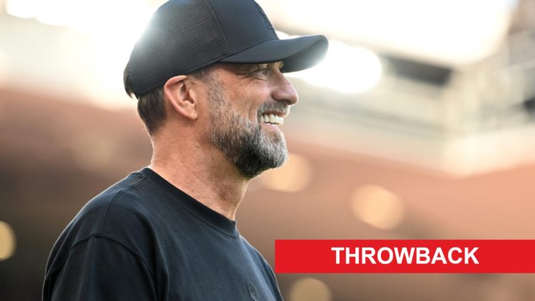 Jurgen Klopp pictured on the Liverpool touchline with a throwback banner in the bottom right corner of the picture.