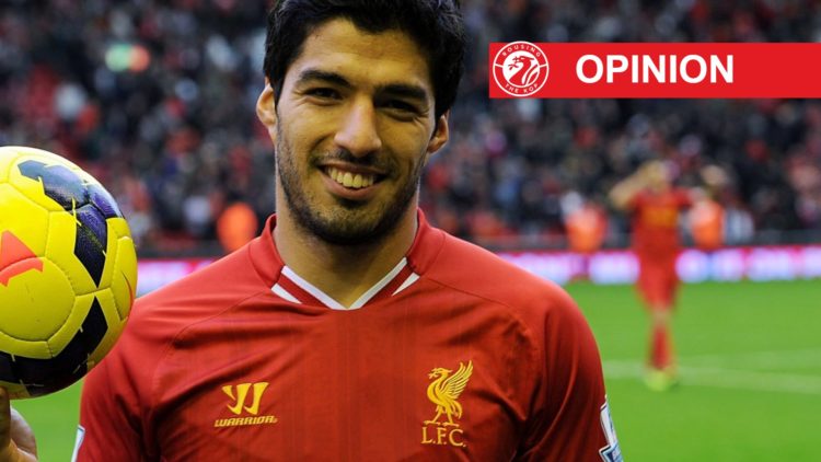 Luis Suarez poses with the match ball after scoring a Premier League hat-trick for Liverpool against West Bromwich Albion at Anfield.