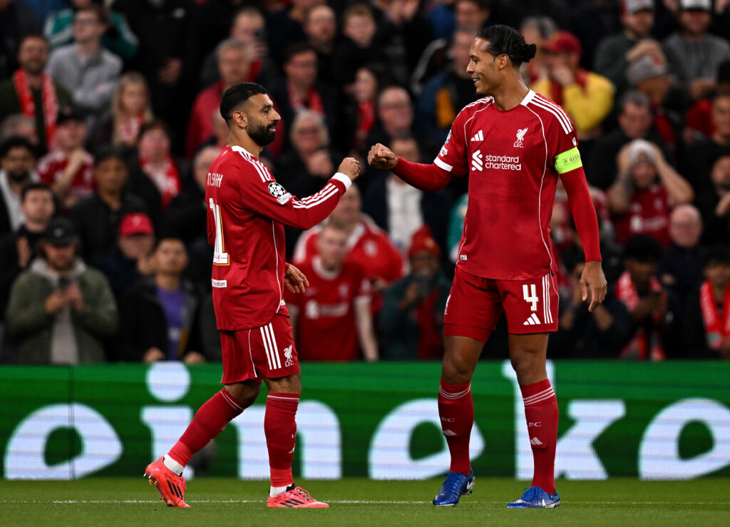 Mohamed Salah of Liverpool celebrates scoring his team's second goal with Virgil van Dijk during the UEFA Champions League 2025/26 League Phase MD1 match between Liverpool FC and Atletico de Madrid at Anfield