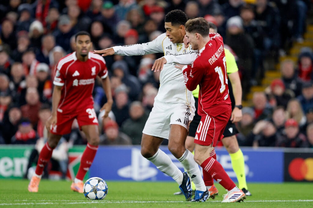 Jude Bellingham of Real Madrid CF and Alexis Mac Allister of Liverpool challenge during the UEFA Champions League 2025/26 League Phase MD4 match between Liverpool FC and Real Madrid C.F. at Anfield.