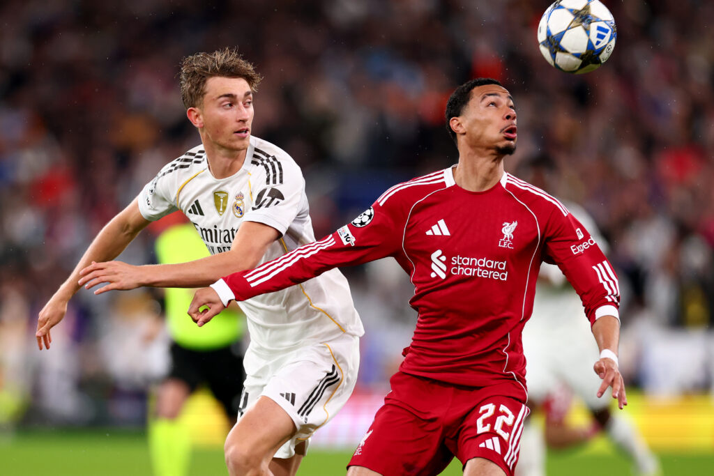 Hugo Ekitike of Liverpool competes for the ball with Dean Huijsen of Real Madrid during the UEFA Champions League 2025/26 League Phase MD4 match between Liverpool FC and Real Madrid C.F. at Anfield.