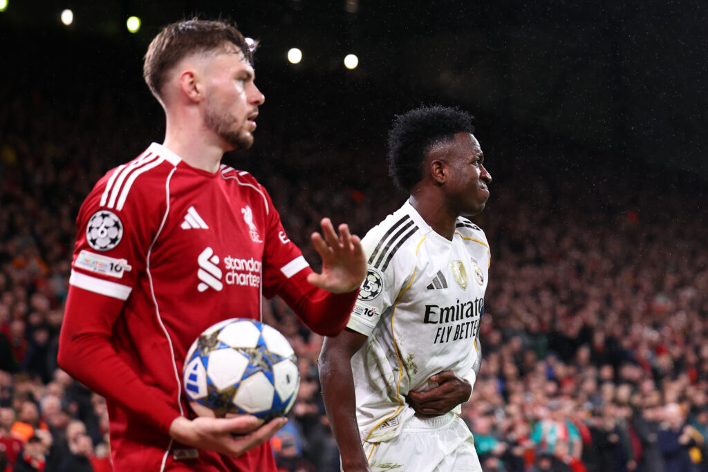 Conor Bradley of Liverpool and Vinicius Junior of Real Madrid during the UEFA Champions League 2025/26 League Phase MD4 match between Liverpool FC and Real Madrid C.F. at Anfield.