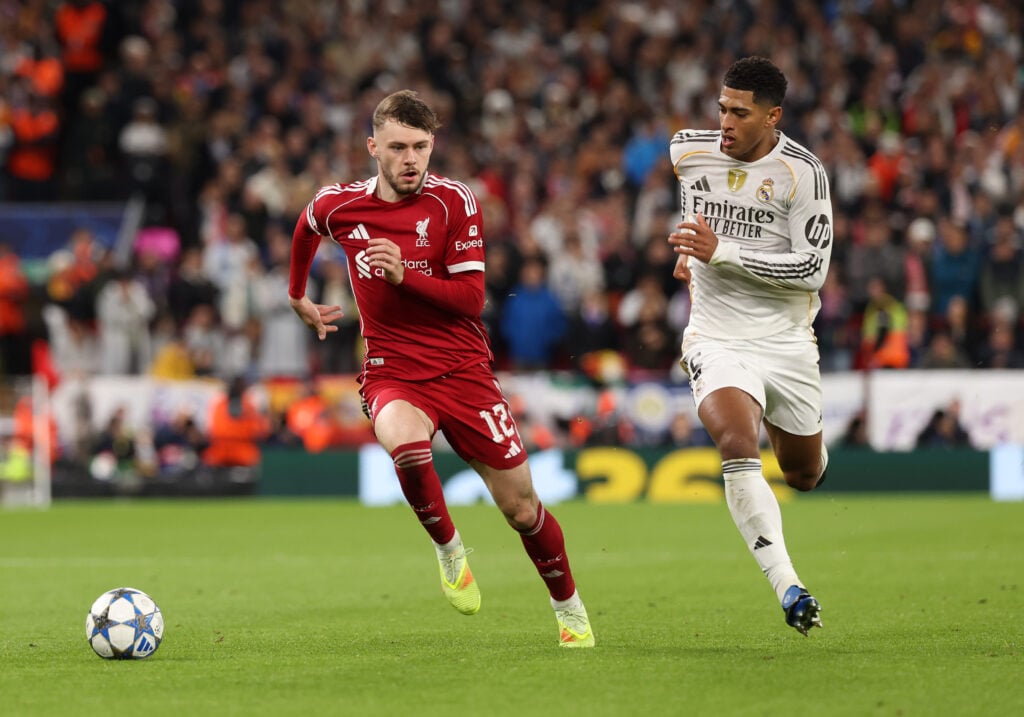 Conor Bradley of Liverpool breaks away from Jude Bellingham of Real Madrid during the UEFA Champions League 2025/26 League Phase MD4 match between Liverpool FC and Real Madrid C.F. at Anfield