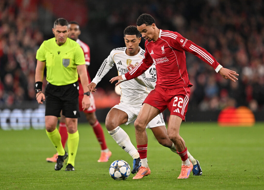 Hugo Ekitike of Liverpool battles for possession with Jude Bellingham of Real Madrid during the UEFA Champions League 2025/26 League Phase MD4 match between Liverpool FC and Real Madrid C.F. at Anfield.