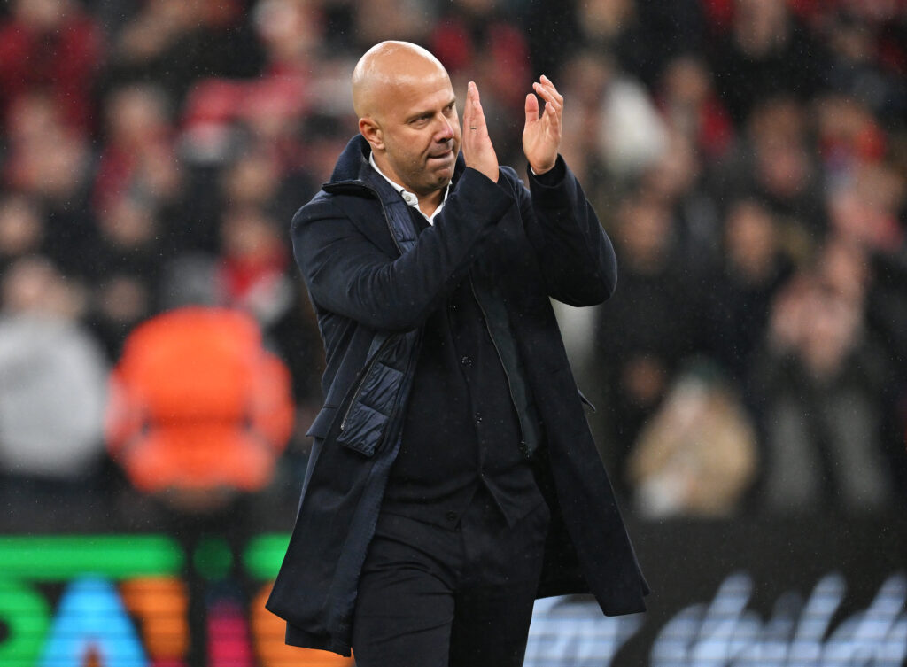 Arne Slot clapping the Liverpool fans after their win versus Real Madrid.