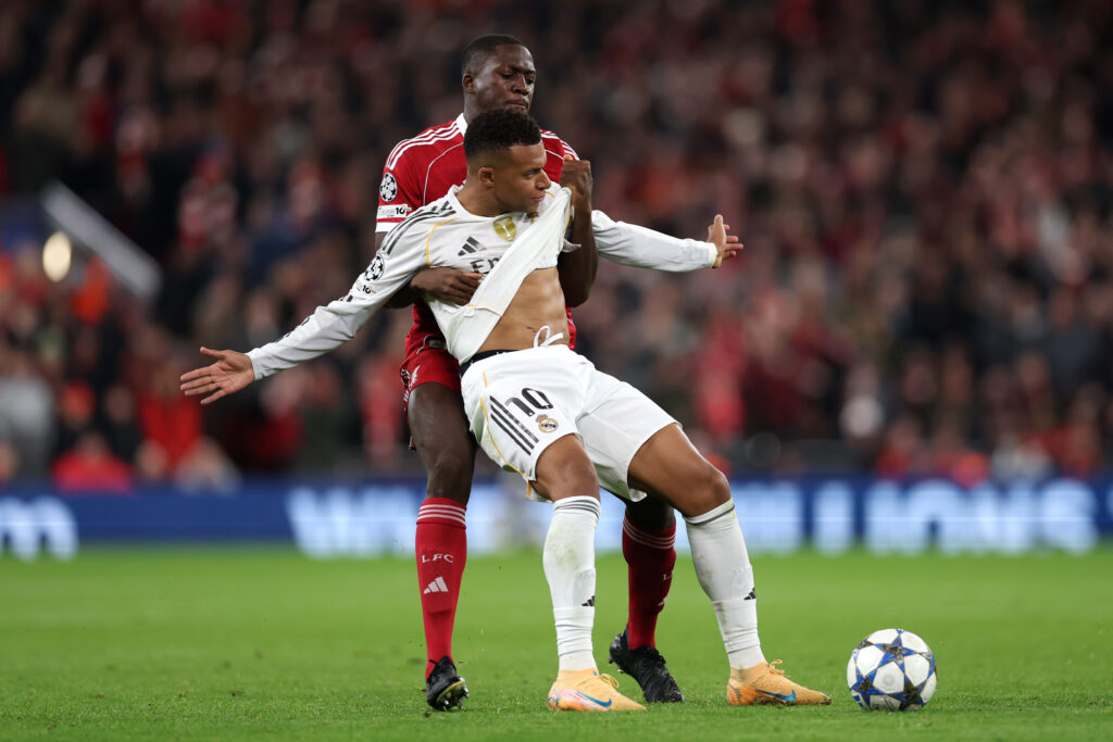 Kylian Mbappe of Real Madrid holds off Ibrahima Konate of Liverpool during the UEFA Champions League 2025/26 League Phase MD4 match between Liverpool FC and Real Madrid C.F. at Anfield.