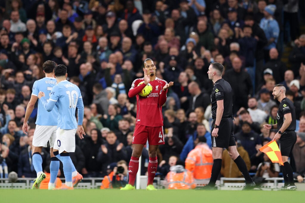 Virgil van Dijk of Liverpool reacts towards Referee Chris Kavanagh after he awards a penalty to Manchester City following a foul on Jeremy Doku of Manchester City (not pictured) by Giorgi Mamardashvili of Liverpool (not pictured) during the Premier League match between Manchester City and Liverpool at Etihad Stadium