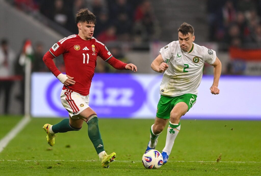 Milos Kerkez of Hungary in action against Seamus Coleman of Republic of Ireland during the FIFA World Cup 2026 Group F Qualifier match between Hungary and Republic of Ireland at Puskás Aréna