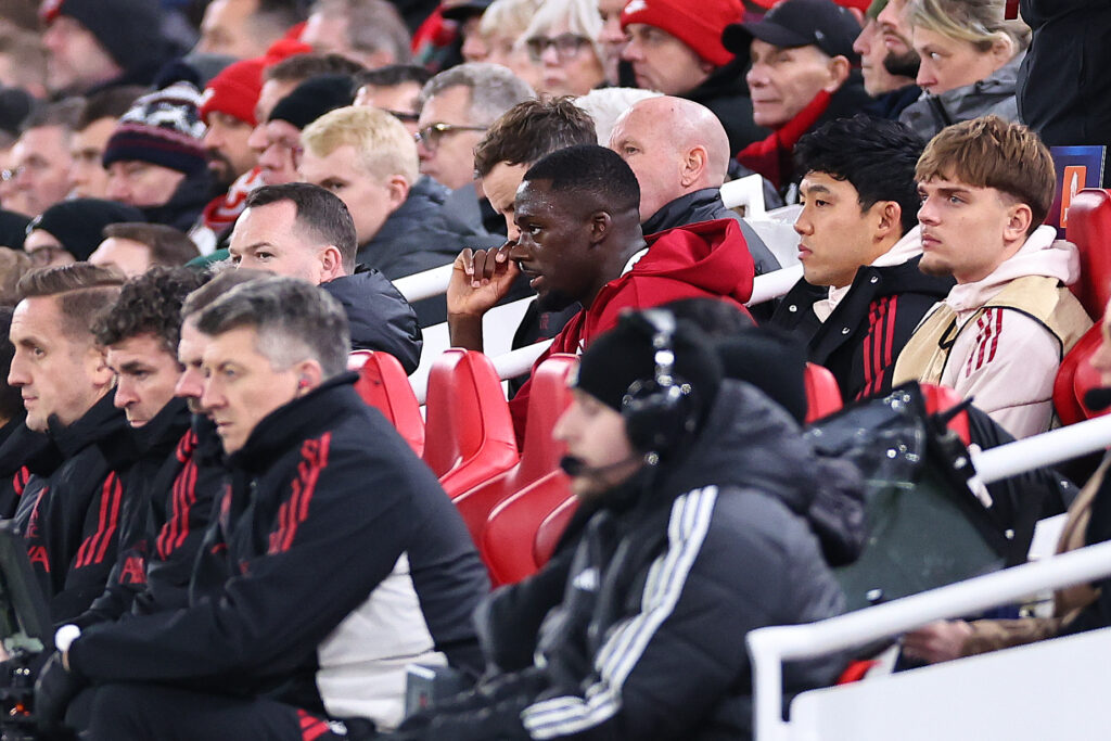Ibrahima Konate sits on the bench after being taken off during Liverpool's UEFA Champions League match against PSV Eindhoven at Anfield.