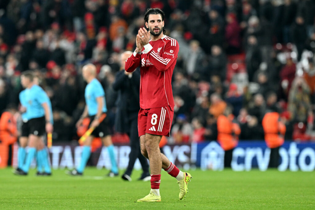Dominik Szoboszlai applauds after Liverpool's UEFA Champions League match against PSV Eindhoven.