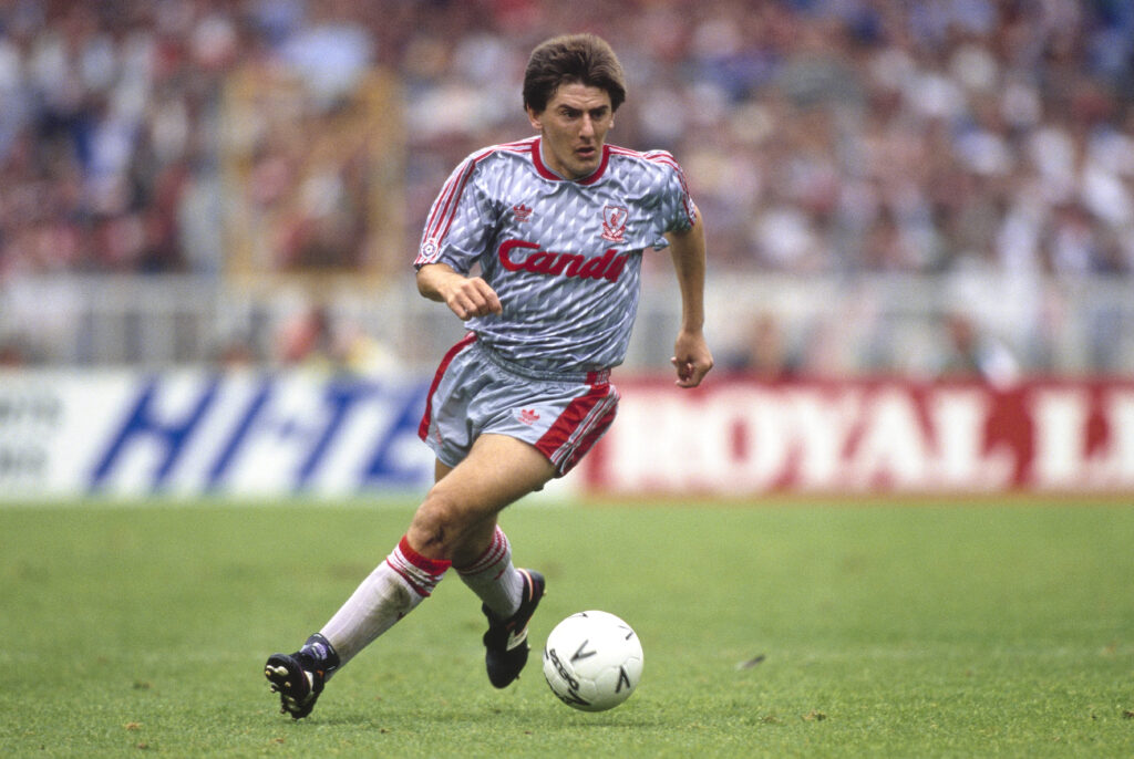 Liverpool player Peter Beardsley in action wearing the grey and red striped, Candy sponsored Adidas kit during the 1990 FA Charity Shield match between Liverpool and Manchester United at Wembley
