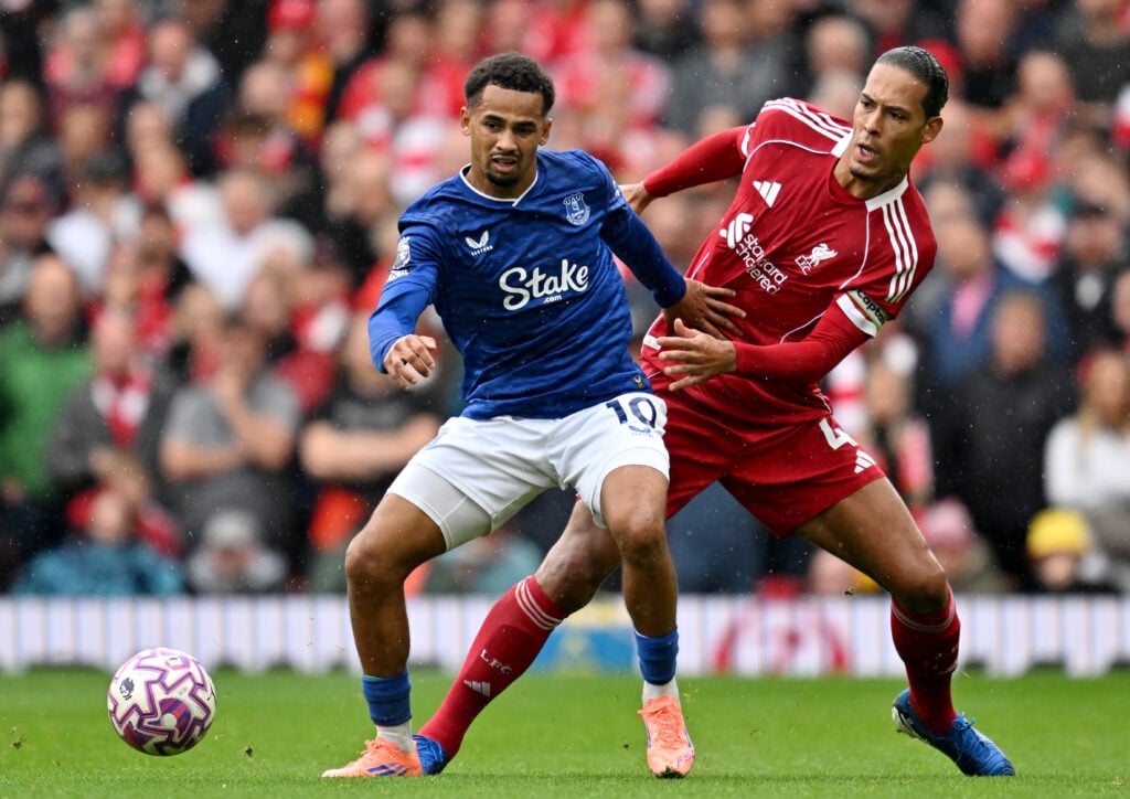 Iliman Ndiaye of Everton challenges Liverpool's Virgil van Dijk during the Premier League Merseyside Derby at Anfield.