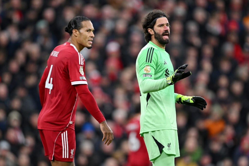 Virgil van Dijk and Alisson Becker pictured playing during Liverpool's Premier League match against Nottingham Forest at Anfield.