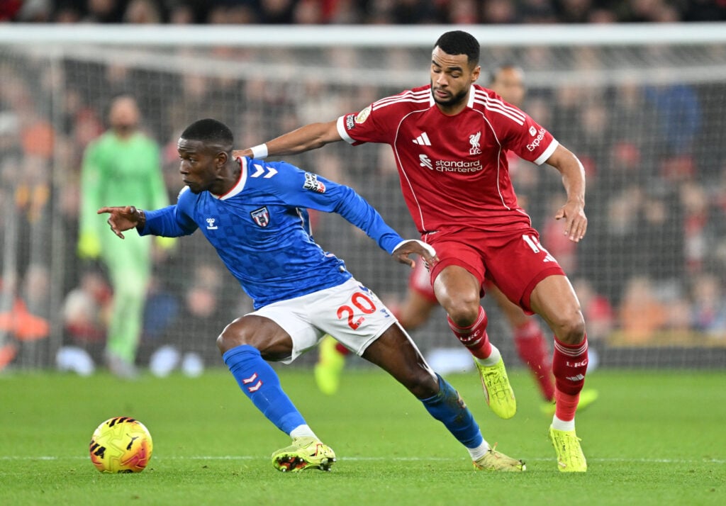 Cody Gakpo challenges Nordi Mukiele during Liverpool's Premier League match against Sunderland at Anfield.