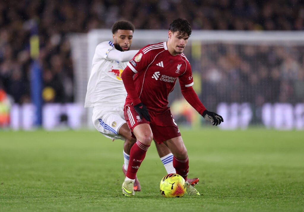 Milos Kerkez battles Jayden Bogle for the ball during Liverpool's Premier league match against Leeds United at Elland Road.