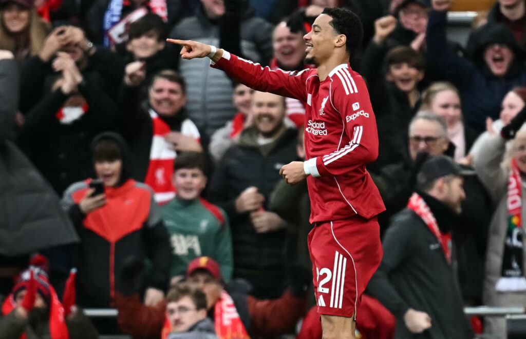 Liverpool's French striker #22 Hugo Ekitike (2L) celebrates scoring the opening goal during the English Premier League football match between Liverpool and Brighton and Hove Albion at Anfield