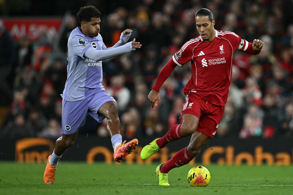 Brighton's French midfielder #10 Georginio Rutter (L) challenges Liverpool's Dutch defender #04 Virgil van Dijk during the English Premier League football match between Liverpool and Brighton and Hove Albion at Anfield